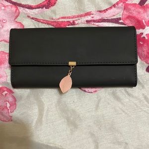 Sleek Black Wallet with Cute Pink Feather Detail